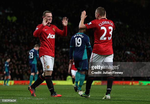 Wayne Rooney of Manchester United is congratulated by Tom Cleverley of Manchester United after he scored the third goal during the Barclays Premier...