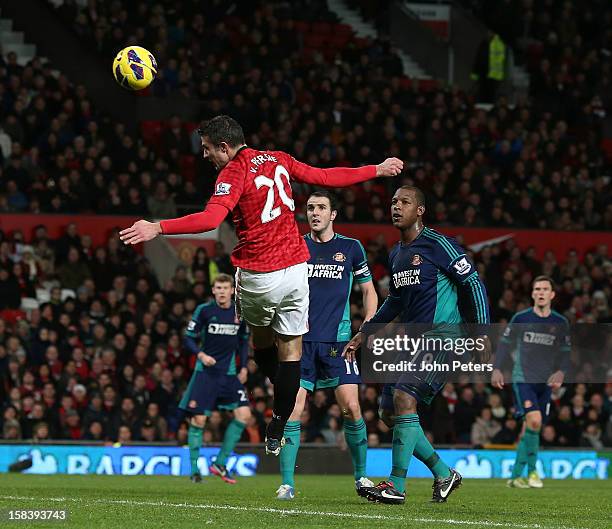 Robin van Persie of Manchester United has a header on goal during the Barclays Premier League match between Manchester United and Sunderland at Old...