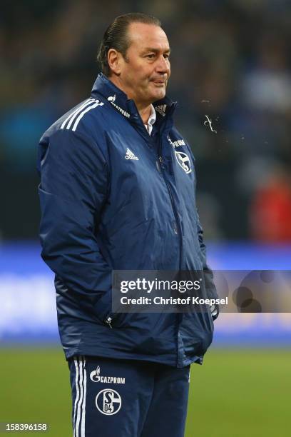 Head coach Huub Stevens of Schalke spitts during the Bundesliga match between FC Schalke 04 and SC Freiburg at Veltins-Arena on December 15, 2012 in...