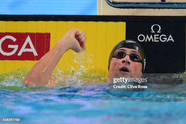 Ryan Lochte of USA celebrates after breaking a new world record in the Men's 100m Individual Medley semi final during day four of the 11th FINA Short...