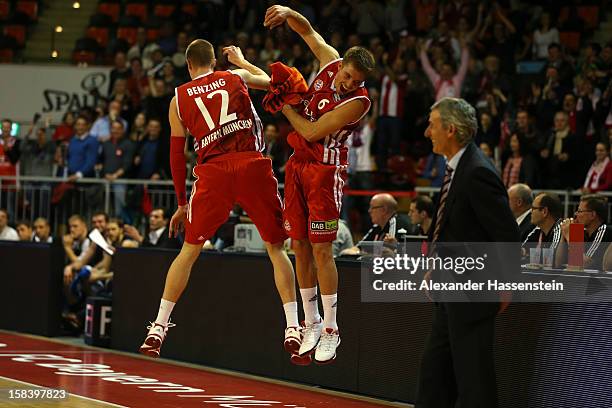 Robin Benzing of Muenchen celebrates victory with his team mate Steffen Hamann after winning the Beko Basketball match between FC Bayern Muenchen and...