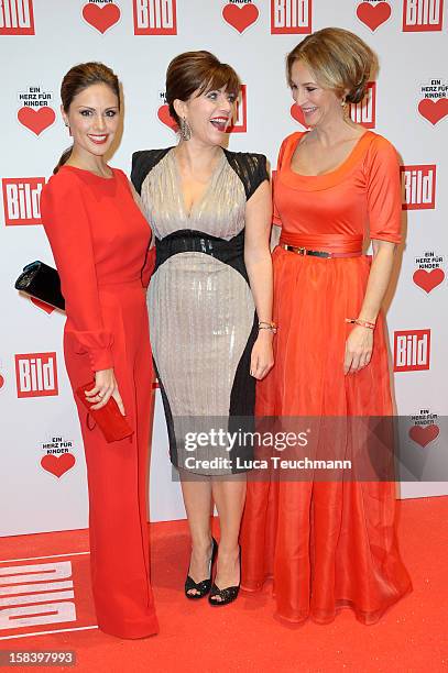 Nazan Eckes, Birgit Schrowange and Caroline Beil attends 'Ein Herz Fuer Kinder Gala 2012' - Red Carpet Arrivals at Axel Springer Haus on December 15,...