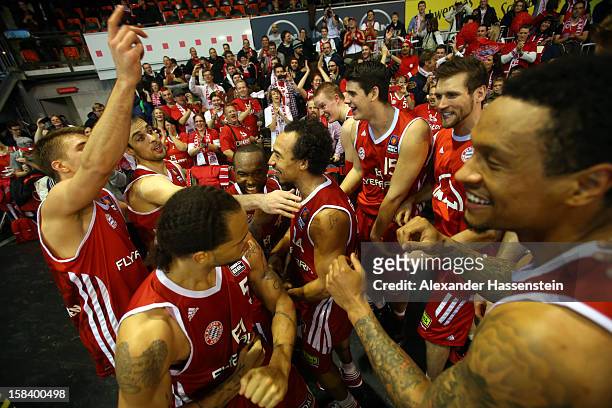 Players of Muenchen celebrate victory with their supporters after winning the Beko Basketball match between FC Bayern Muenchen and Walter Tigers...