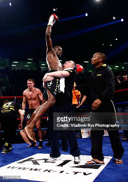 Murthel Groenhart of Netherlands is celebrated by his team members after winning the final fight against Artur Kyshenko of Ukraine during the K-1...