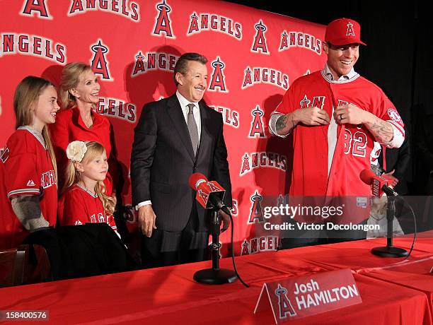 Julia Hamilton, Sierra Hamilton, Carole Moreno, Owner Arte Moreno of the Los Angeles Angels of Anaheim watch as Josh Hamilton of the Los Angeles...