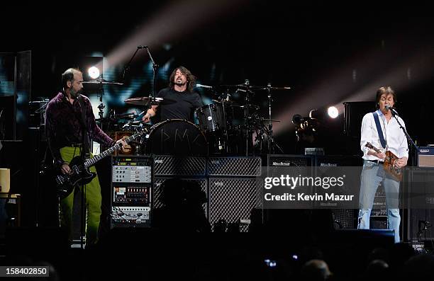 Krist Novoselic, Dave Grohl and Sir Paul McCartney perform at "12-12-12" a concert benefiting The Robin Hood Relief Fund to aid the victims of...