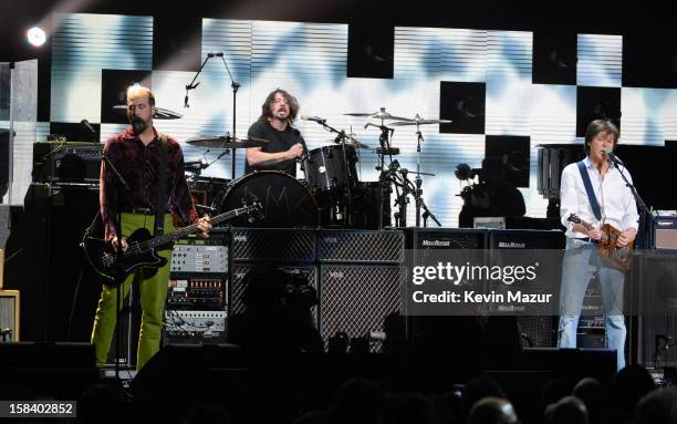 Krist Novoselic, Dave Grohl and Sir Paul McCartney perform at "12-12-12" a concert benefiting The Robin Hood Relief Fund to aid the victims of...