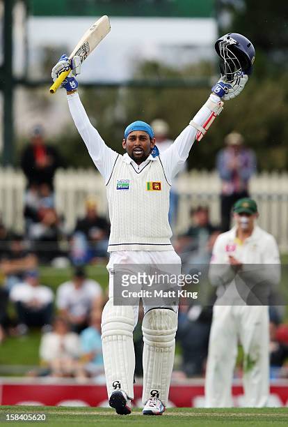 Tillakaratne Dilshan of Sri Lanka celebrates scoring a century during day three of the First Test match between Australia and Sri Lanka at Blundstone...