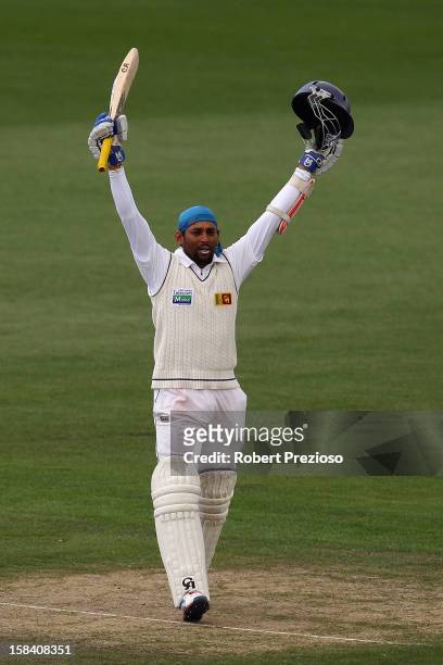 Tillakaratne Dilshan of Sri Lanka celebrates after reaching his century during day three of the First Test match between Australia and Sri Lanka at...