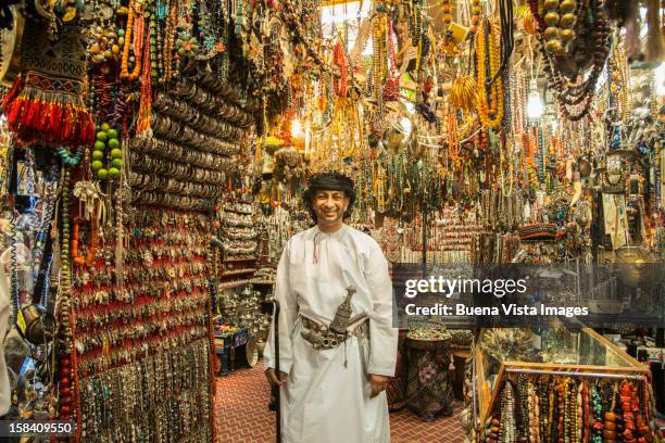 merchant in his shop in the souk of muscat. - oman foto e immagini stock