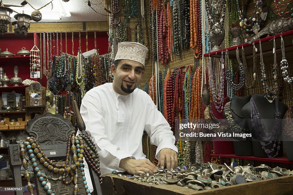 Merchant in his shop in the Souk of Muscat.