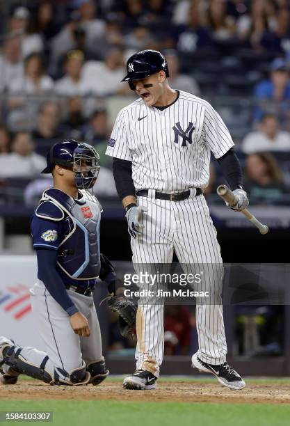 Anthony Rizzo of the New York Yankees reacts after striking out during the ninth inning against the Tampa Bay Rays at Yankee Stadium on July 31, 2023...