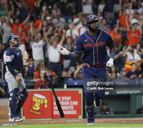 Yordan Alvarez of the Houston Astros flips his bat after hitting a three-run home run in the sixth inning against the Cleveland Guardians at Minute...