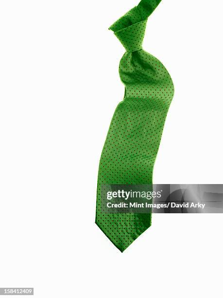 a knotted green fabric tie, or necktie. - tying stock-grafiken, -clipart, -cartoons und -symbole