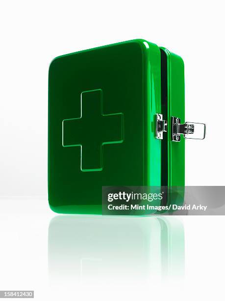 green metal first aid box with fastener and large cross on the top. - medical symbol stock pictures, royalty-free photos & images