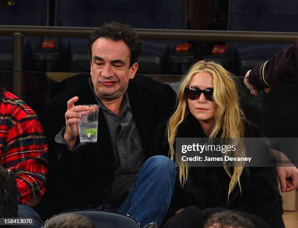 Olivier Sarkozy and Mary-Kate Olsen attend the Cleveland Cavaliers vs New York Knicks game at Madison Square Garden on December 15, 2012 in New York...