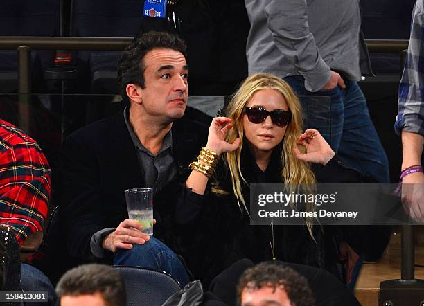 Olivier Sarkozy and Mary-Kate Olsen attend the Cleveland Cavaliers vs New York Knicks game at Madison Square Garden on December 15, 2012 in New York...