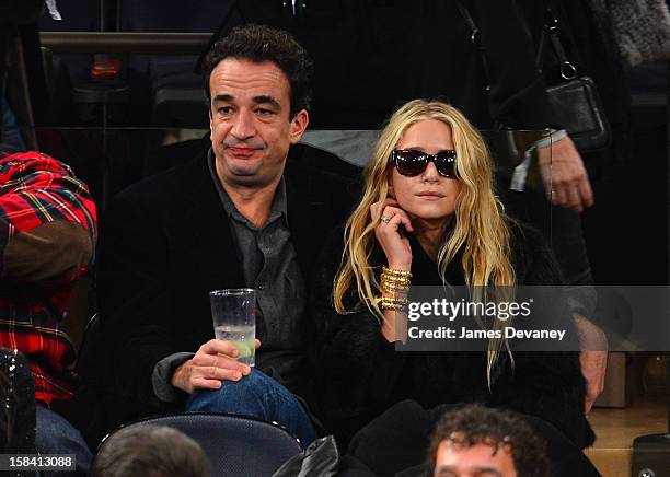 Olivier Sarkozy and Mary-Kate Olsen attend the Cleveland Cavaliers vs New York Knicks game at Madison Square Garden on December 15, 2012 in New York...