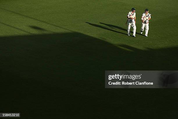 Ed Cowan and David Warner of Australia walk off the ground after play on day three of the First Test match between Australia and Sri Lanka at...