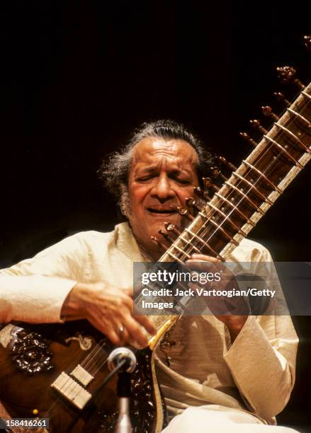 Indian musician Ravi Shankar plays sitar during a performance at a World Music Institute concert in Alice Tully Hall at Lincoln Center, New York, New...