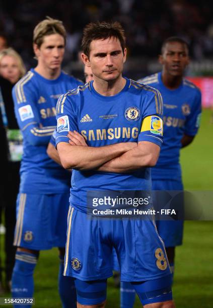 Dejected Frank Lampard of Chelsea with team mates Fernando Torres and Ramires wait for the awards ceremony after the FIFA Club World Cup Final Match...