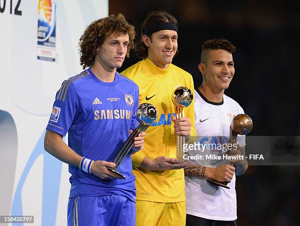 David Luiz of Chelsea , Cassio of Corinthians and Paolo Guerrero of Corinthians hold aloft their respective Adidas Best Player of the Tournament...