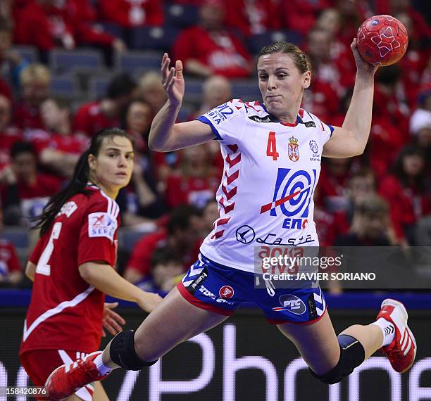 Serbia's Jelena Popovic throws the ball past Hungary's Orsolya Verten during the women's EHF Euro 2012 Handball Championship small final match...