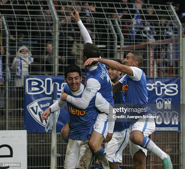 Mirkan Aydin of Bochum is hugged by teammates during the Second Bundesliga match between VfL Bochum and SC Paderborn at Rewirpower Stadium on...