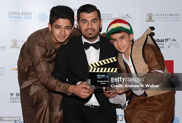 Actor Sarwar Fazil, director Karzan Kader and actor Zamand Taha with their People Choice award during the Closing Ceremony on day eight of the 9th...