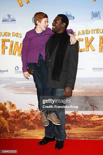Leon Seidel and Jacky Ido attend 'Die Abenteuer des Huck Finn' Germany Premiere on December 16, 2012 in Berlin, Germany.