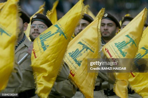 Members of Lebanon's Shiite Muslim militant group Hezbollah parade in the streets of the southern suburbs of Beirut to mark Jerusalem Day 21 November...