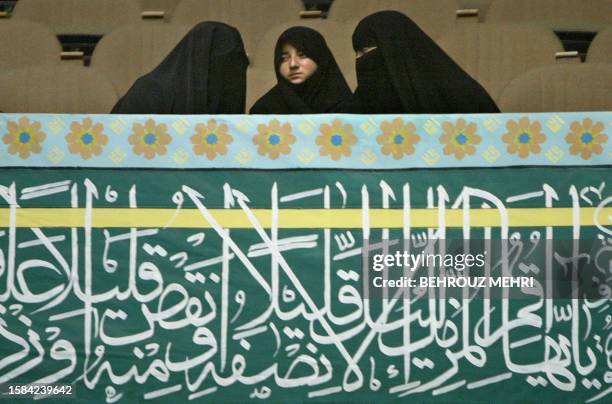 Three Iranian women attend a Shiite Muslim religious meeting in Tehran, 09 October 2003. A 34-year-old Iranian nurse convicted of murder was executed...