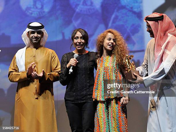 Sheikh Mansoor bin Mohammed bin Rashid Al Maktoum, director Haifaa Al Mansour and actress Waad Mohammed on stage during the Closing Ceremony on day...