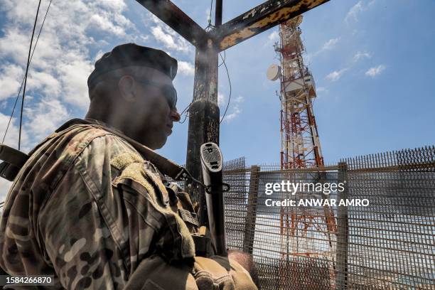 Lebanese army soldier stands guard in an observation tower overlooking the border area near Naqura in southern Lebanon on August 8, 2023.