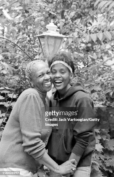 American singer Cissy Houston and her daughter, singer and actress Whitney Houston in the backyard of her home, West Orange, New Jersey, May 28, 1985.