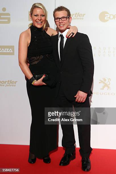 Fabian Hambuechen poses with girl friend Caroline after their arrival at the 'Athlete of the Year 2012' gala at the Kurhaus Baden-Baden on December...
