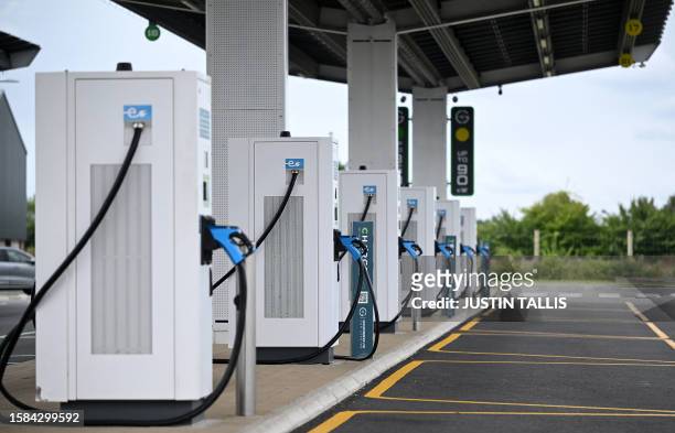 Charging connectors are pictured in their docks at Gridserve E-charging station for all-electric cars, near Braintree, eastern England on August 8,...