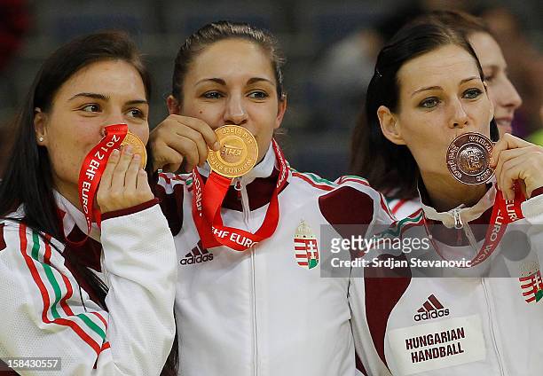 Hungary players Anita Gorbicz Orsolya Verten and Zita Szucsanszki posing with medals during the Women's European Handball Championship 2012 medal...