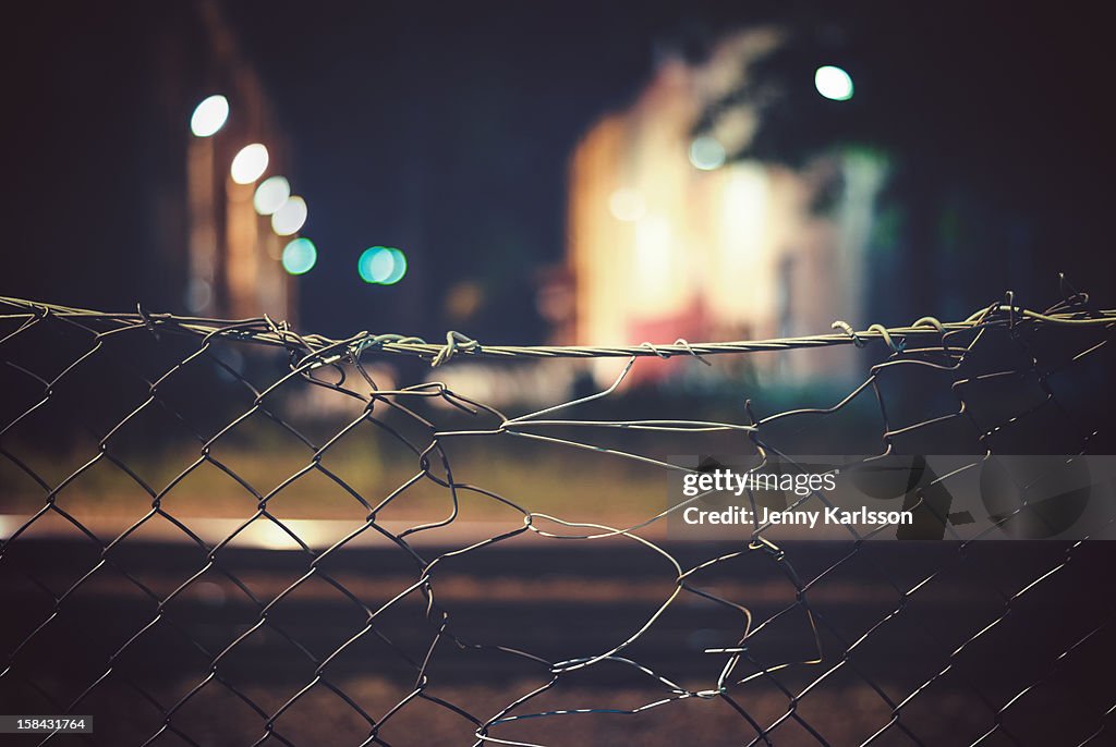 Chain link fence at railroad and industrial area
