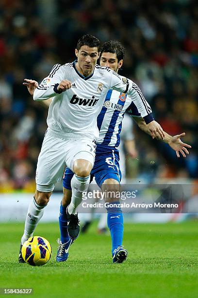 Crsitiano Ronaldo of Real Madrid CF competes for the ball with Juan Daniel Forlin of RCD Espanyol during the La Liga match between Real Madrid CF and...