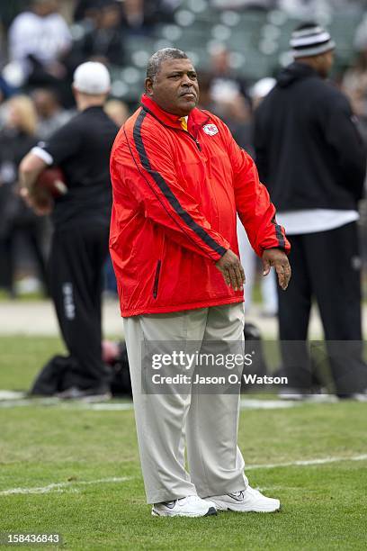 Head coach Romeo Crennel of the Kansas City Chiefs watches his team during warm ups before the game against the Oakland Raiders at O.co Coliseum on...