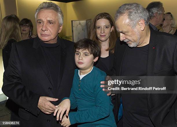 Singer Michel Sardou , comedian Francis Perrin , Perrin's wife Gersende, rear center, and their son Louis share a moment in Sardou's dressing room...