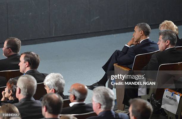 President Barack Obama attends a memorial service for the victims of the Sandy Hook Elementary School shooting on December 16, 2012 in Newtown,...