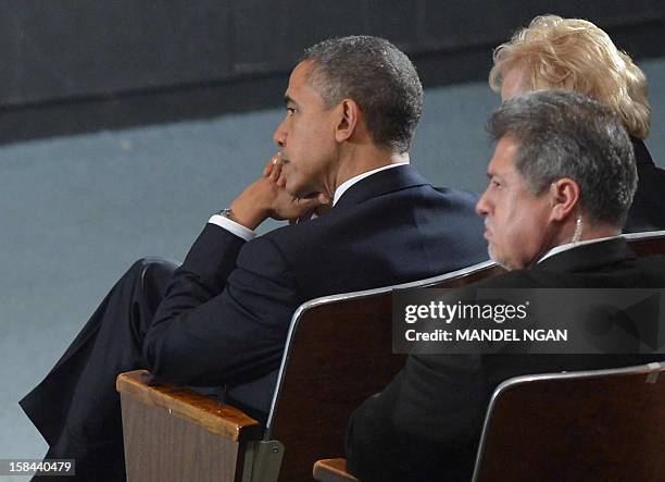 President Barack Obama attends a memorial service for the victims of the Sandy Hook Elementary School shooting on December 16, 2012 in Newtown,...