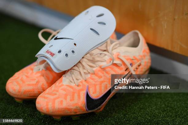 Shin guards and boots of Megan Rapinoe are displayed in the USA dressing room prior to the FIFA Women's World Cup Australia & New Zealand 2023 Group...