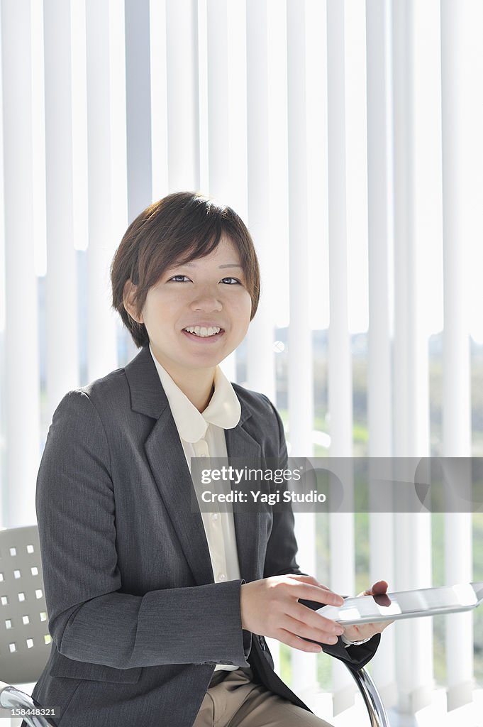 Businesswoman using digital tablet