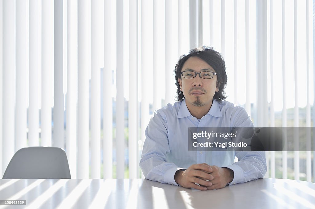 Businessman sitting in meeting desk