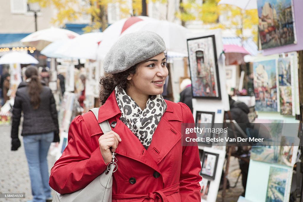 Woman Looking at paintings at Montmartre, Paris.