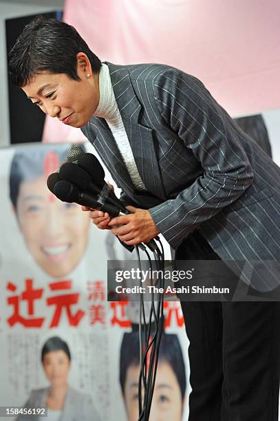 Kiyomi Tsujimoto of Democratic Party of Japan bows after losing in the Osaka No.10 Constituency at her election campaign office on December 16, 2012...