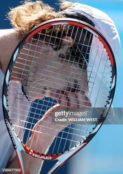 British tennis player Andy Murray gestures after defeat in his mens singles match against French opponent Jo-Wilfried Tsonga at the Australian Open...